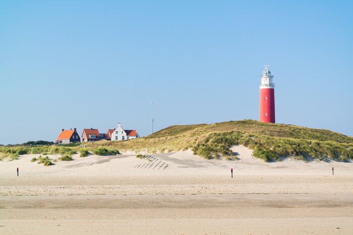 Papier peint  Phare maritime rouge sur les dunes