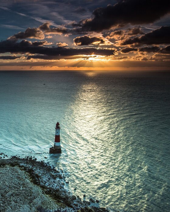 Papier peint  Phare sur une mer turquoise