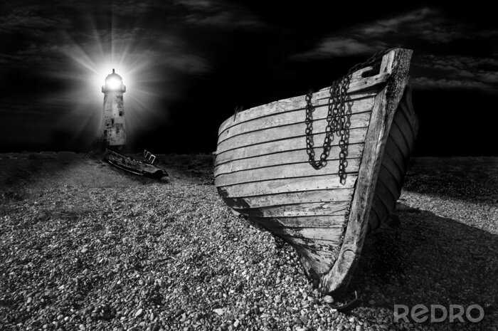 Papier peint  Phare sur une plage de nuit