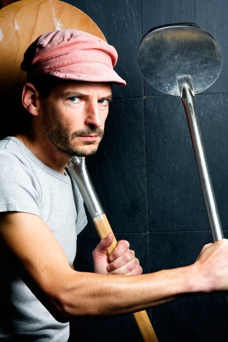 Papier peint  Pizzaiolo AVEC des pelles à pizzas