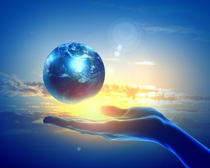 Papier peint  Planète Terre illuminée sur une main