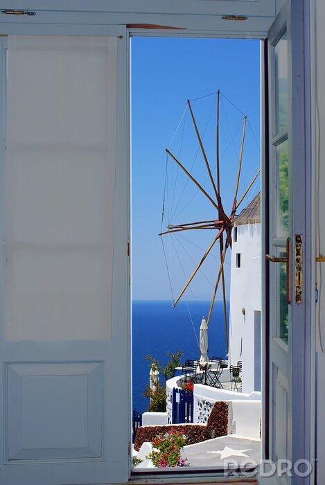 Papier peint  Porte avec vue sur un moulin à vent