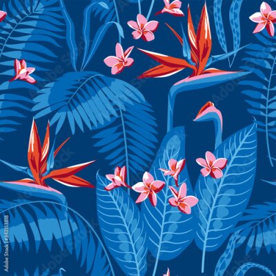 Papier peint  Seamless pattern of tropical leaves and flowers of plumeria and strelitzia on a dark blue background.