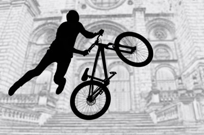 Papier peint  Silhouette de cycliste et vélo sur fond d'immeuble