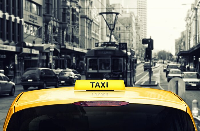 Papier peint  Taxi suivant un tramway