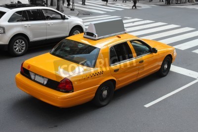 Papier peint  Taxi sur fond d'une rue grise