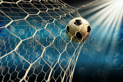 Papier peint  Un ballon de football qui entre dans le but