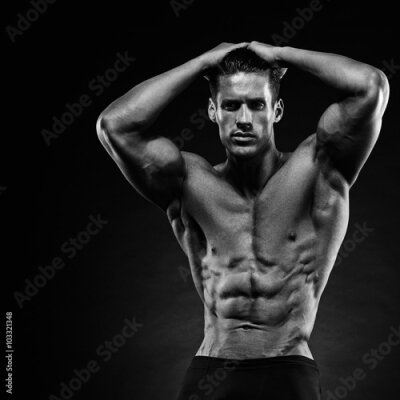 Papier peint  Un homme musclé sur fond noir