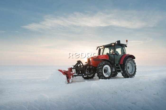 Papier peint  Un tracteur déneigeant une route