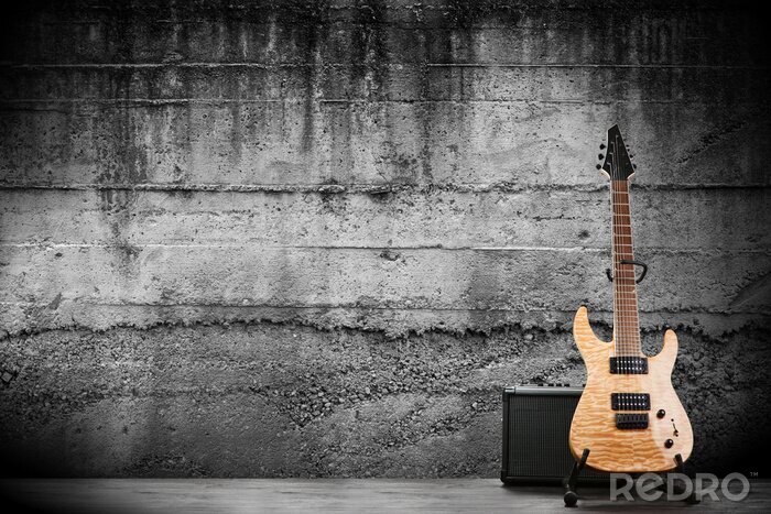 Papier peint  Une guitare électrique sur fond de béton
