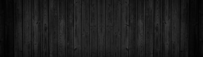 Vieilles planches verticales noires en bois
