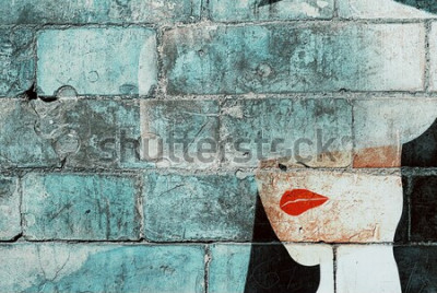 Papier peint  Visage de femme peint sur un mur