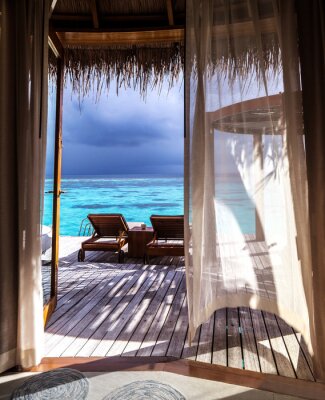 Papier peint  Vue depuis une fenêtre de terrasse sur un océan bleu