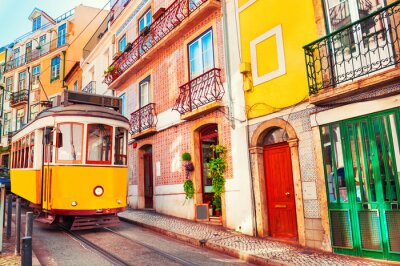 Papier peint  Yellow vintage tram on the street in Lisbon, Portugal. Famous travel destination