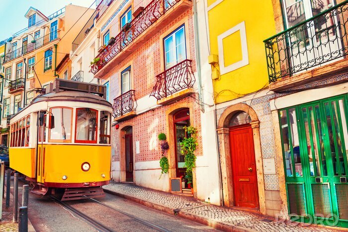 Papier peint  Yellow vintage tram on the street in Lisbon, Portugal. Famous travel destination
