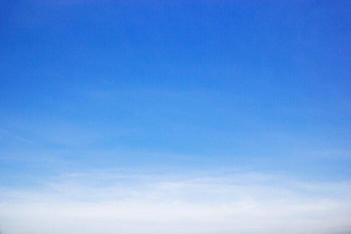 Poster  Blue sky background and white clouds soft focus, and copy space