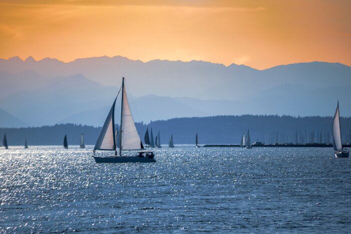 Poster  Distant sailboats on the Salish sea with Olympic Mountains at sunset.