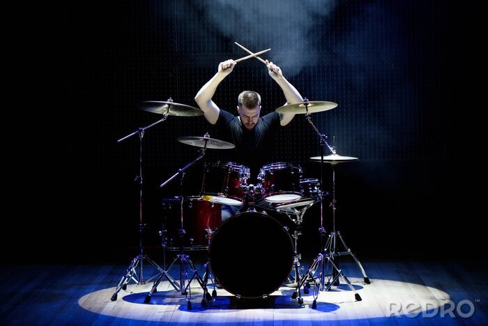 Poster  Drummer playing the drums with smoke and powder in the background