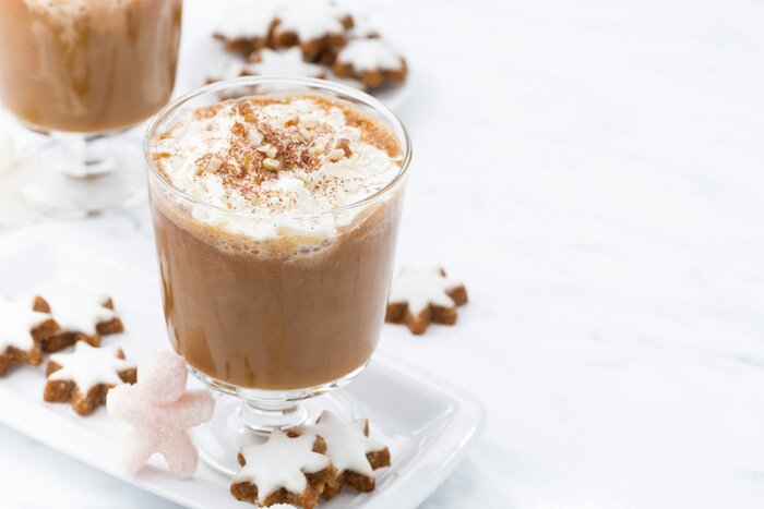 Poster  festive pumpkin latte and almond cookies on a white background