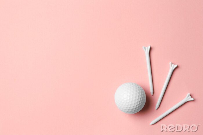 Poster  Golf ball and tees on pink background, flat lay. Space for text