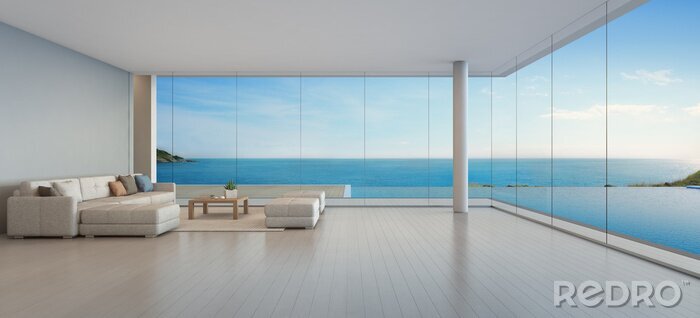 Poster  Grand canapé sur plancher en bois près de la fenêtre en verre et piscine avec terrasse à l'appartement penthouse, salon dans la vue sur la mer salon de luxe moderne maison de plage ou un hôtel - Home 