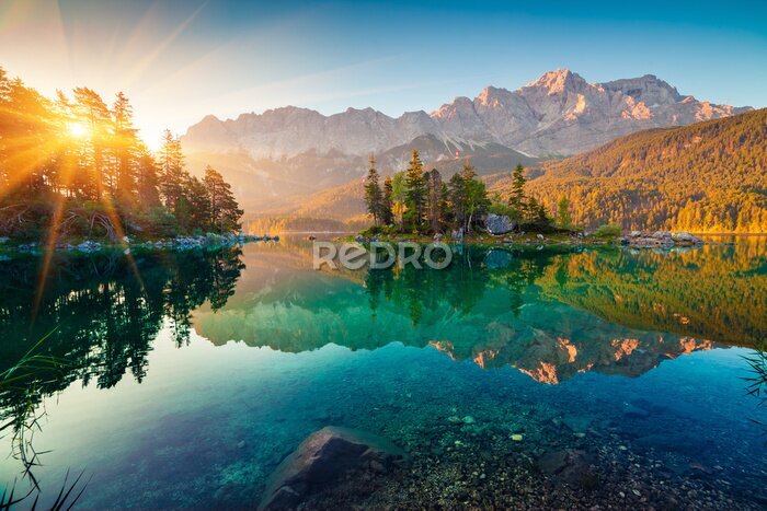 Poster  Impressive summer sunrise on Eibsee lake with Zugspitze mountain range. Sunny outdoor scene in German Alps, Bavaria, Germany, Europe. Beauty of nature concept background.