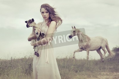 Poster  Jeune femme brune tenant petit agneau