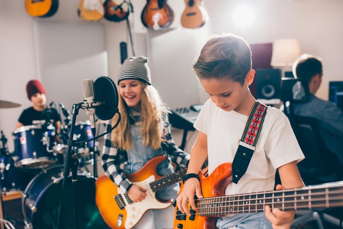 Poster  kids rock band in music studio