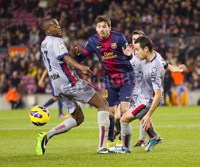 Poster  Lionel Messi du FCB en action lors du match de la ligue espagnole entre le FC Barcelone et Osasuna, score final 5 - 1, le 27 Janvier 2013, à Barcelone, Espagne