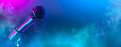 Poster  Microphone on stage close-up. Mic closeup. Karaoke, night club, bar. Music concert. Mike over colorful lights background. Song, music concept wide backdrop, border art design