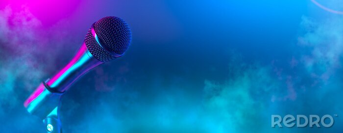 Poster  Microphone on stage close-up. Mic closeup. Karaoke, night club, bar. Music concert. Mike over colorful lights background. Song, music concept wide backdrop, border art design
