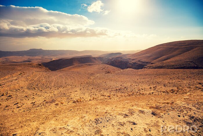 Poster  Mountainous desert with a beautiful cloudy sky. Desert in Israel at sunset