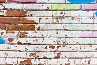 Poster  Mur de briques et peinture écaillée