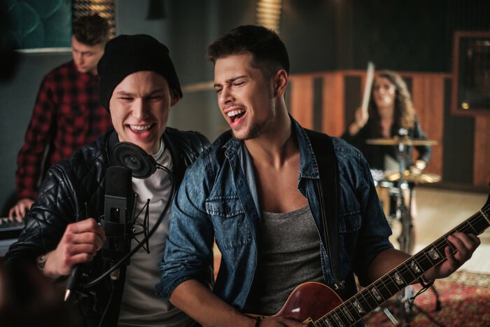 Poster  Music band having rehearsal in a studio