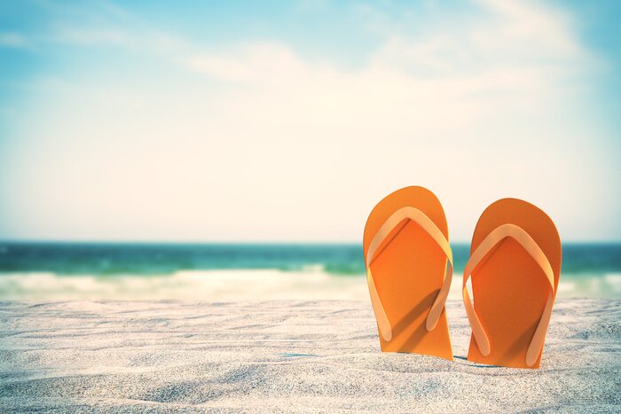 Poster  Orange flip flops on beach