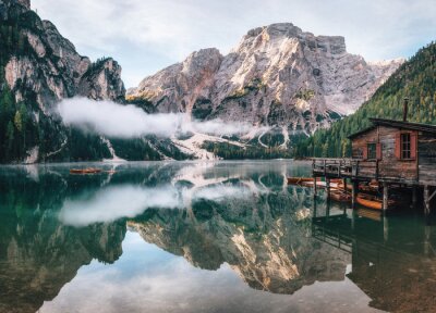 Papier peint  Panoramic view of Braies Lake with the hut and boats in Dolomites mountains and Seekofel in the morning, Pragser Wildsee, South Tirol, Italy