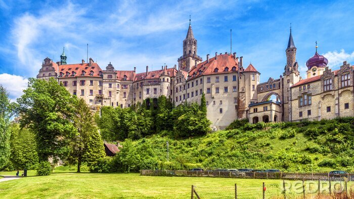 Poster  Sigmaringen Castle in summer, Germany. This famous Gothic castle is a landmark of Baden-Wurttemberg. Panorama of old German castle on a hill. Scenic view of beautiful medieval palace on sunny day.