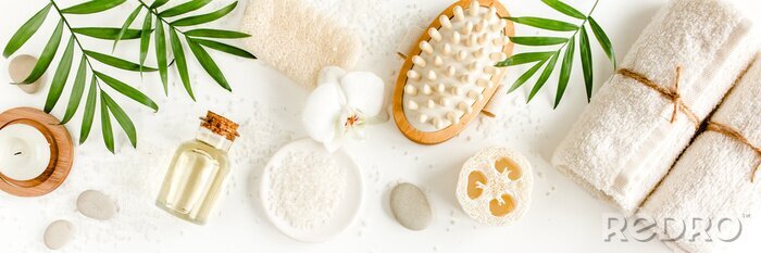 Poster  Spa Background. Natural/Organic spa cosmetics products, eco friendly bathroom accessories, eucalyptus leaves. Skincare concept on white background. Flat lay, top view