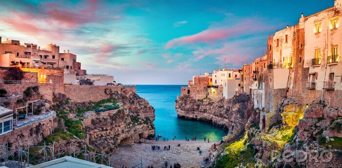 Poster  Spectacular spring cityscape of Polignano a Mare town, Puglia region, Italy, Europe. Colorful evening seascape of Adriatic sea. Traveling concept background..