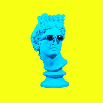 Poster  Statue on a yellow background. Gypsum statue of David's head. Creative. Plaster statue of Apollo's head in blue sunglasses. Minimal concept art.