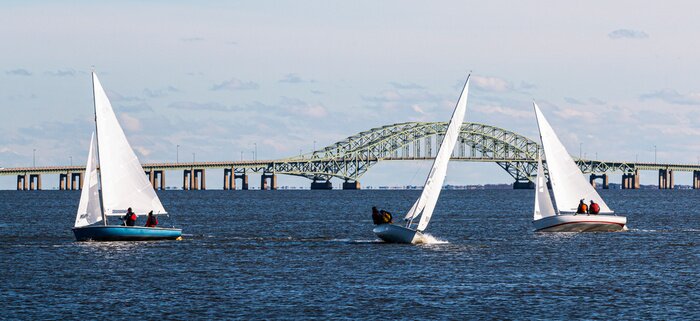 Poster  Three two person sailboats in front of the Great South Bay bridge on a windy December afternoon