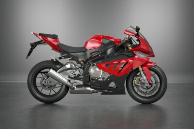 Une moto puissante avec des accents rouges sur fond gris