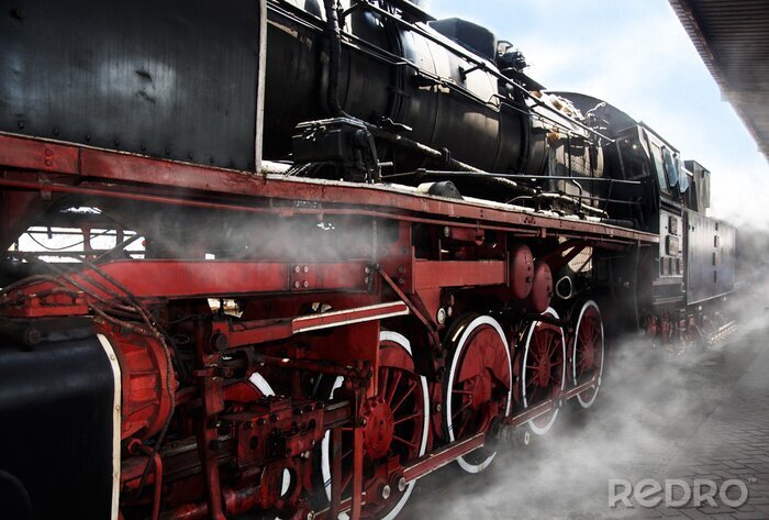 Poster  Une vieille locomotive dans des nuages de vapeur