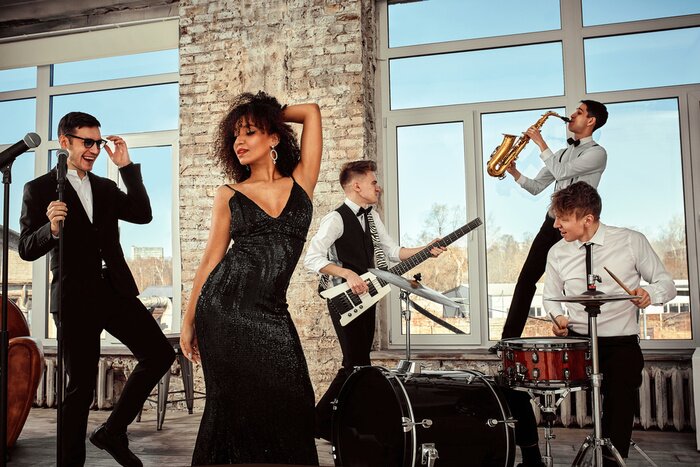 Poster  Young international musicians, a band performing on the loft stage. The concept of music, hobby, festival. Inspiration creativity.