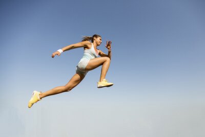 Poster  Young woman taking long jump
