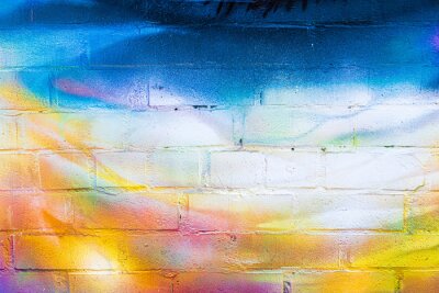 Sticker  A fragment of colorful graffiti painted on a brick wall. Abstract backdrop for design.