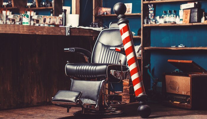 Sticker  Barber shop pole. Logo of the barbershop, symbol. Stylish vintage barber chair. Hairstylist in barbershop interior. Barber shop chair. Barbershop armchair, hairdresser, hair salon, barber shop for men