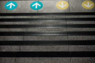 Sticker  Colored Arrow Signs Sticker Placed on The Floor in front of Stairs