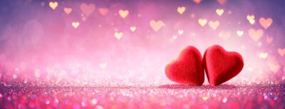 Deux coeurs sur des paillettes roses en arrière-plan brillant - Concept de la Saint-Valentin
