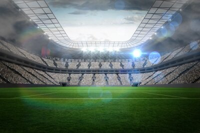 Grand stade de football avec des lumières